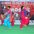 Students of Indo Global Colleges performing at stage on annual day