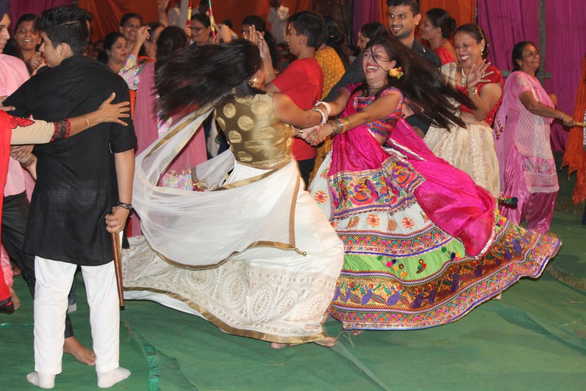 Youngsters dancing in the color of Garba and Dandiya