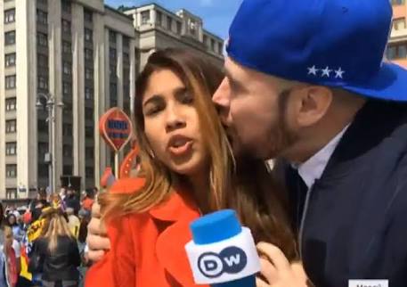 Football fan forcibly kisses Columbian journalist on live TV
