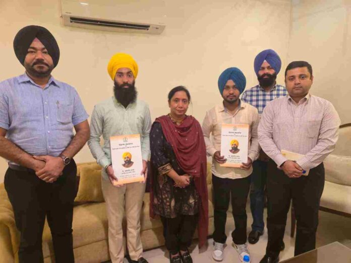 Dr. Baljit Kaur hands over appointment letters to two newly appointed employees of the Social Security Department
